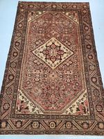 Full view of the Persian Hamedan wool rug showing the central diamond medallion and the border details.