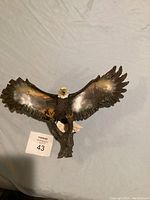 Full view of bald eagle wall art sculpture with wings spread wide.