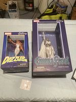 Two Marvel Gallery PVC figurines in original boxes, Dazzler and Emma Frost.