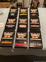 12 WWF VHS tapes with black cases featuring various 'Best of' wrestling collections, arranged in 3 rows.