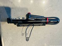 Alternate side view of the pump with hose folded along the body and visible Bontrager Charger branding on the handle.