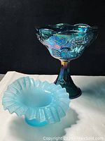 Photo of carnival glass grapevine compote bowl with iridescent finish and pale blue ruffled rim dish without lid
