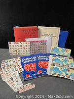 Full view of stamp albums grouped with sheets of stamps, showing album covers and multiple sheet layouts.