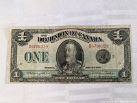 Front view of 1923 Dominion of Canada One Dollar note showing full note and serial number