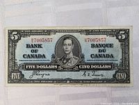 Front view of the 1937 Canadian five dollar bank note showing full note with portrait, serial number and bilingual text.