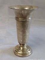 Side view of trumpet-shaped vase showing flared rim and pedestal base