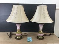 Pair of vintage Mary Gregory style lamps with cream fabric shades and brass bases, shown side by side to display condition and overall appearance.