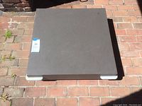 Top view of the square rolling platform showing smooth top surface and wear marks.