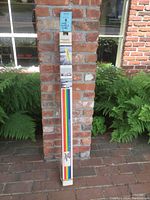 Full packaged kit of 8 rolled panels for the wall mural showing their length tied together and the label with shuttle photos and instructions.