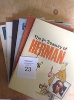 View of stacked Herman treasury comic books including 'The 1st Treasury of Herman' with illustrated cover.