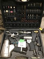 Complete view of pneumatic tool set in molded carrying case showing tools and accessories