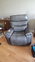 Front view of gray leather recliner