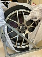 19-inch Audi alloy wheel showing five-spoke design and packaging