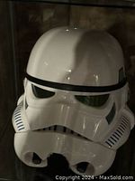 White Stormtrooper helmet on glass shelf