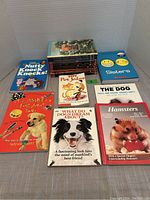 16 books displayed on a flat surface, 7 animal-themed and humor titles including Nutty Knock Knocks and Hamsters (first pet full care).