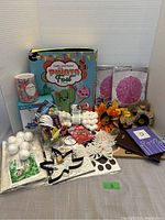 Full lot of assorted craft supplies including the Pinata Fest kit and various decorations and cutouts.