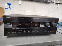 Full view of Yamaha RX-V995 AV receiver showing front control panel and display.