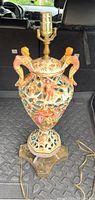Full view of the Capodimonte style porcelain table lamp showing urn-shaped body and top bulb socket
