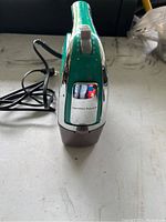 Front view of Hamilton Beach handheld mixer showing speed control and release button