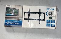 Photo of the Xtreme Tilt TV Wall Mount box designed for 26-55 inch televisions showing brand, model type, and visual on packaging.