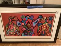 Front view of framed print showing triple figure composition on red background