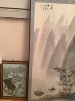 Full view of the framed watercolor showing entire artwork, matting and frame with signature and calligraphy visible in top left corner.