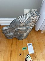 Full front view of soapstone carving with size reference sticker visible