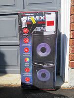Full boxed Monster REMIX karaoke machine with marketing and features printed on side panel.