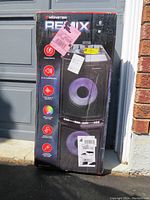 Full boxed Monster REMIX karaoke machine showing front of the box with product image and features.