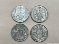 All four coins displayed together showing front with years and coat of arms.