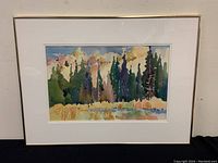 Full front view of framed watercolor painting titled 'Fall Fields' with gold-toned metal frame and white mat