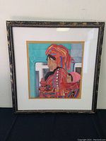 Framed artwork showing the full piece, including ornate frame and matting.