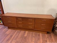 Full front view of dresser showing overall design, drawer arrangement and finish