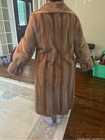 Back view of the vintage brown mink fur coat showing length and fur texture.