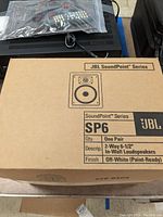 Box front showing JBL SoundPoint Series SP6 2-way 6-1/2 inch in-wall loudspeakers quantity one pair, off-white paint-ready finish.