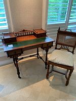 Front view of desk and chair showing overall proportions and style