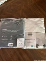 Photo of the 9-piece entertaining set in its original packaging showing the brand Harman, contents of the set, and fabric pattern.