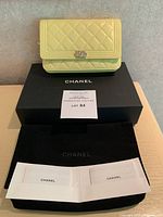 Clutch displayed on Chanel box with authenticity notice