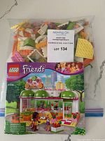 Sealed bag with instruction manual and LEGO pieces for the Heartlake Juice Bar set 41035