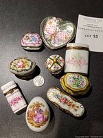All eight porcelain boxes arranged with US quarter and lot tag visible