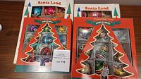 Four original boxes of vintage glass Christmas ornaments labeled Santa Land and Shiny Brite showing packaging and contents windows