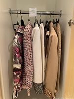 Wide shot of all garments hanging on rail