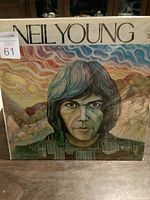 Front view of Neil Young The Last Trip to Tulsa sealed vinyl album cover showing colorful artistic portrait of Neil Young.