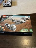 Photo of the unopened box of the Star Wars Lego Mandalorian N-1 Starfighter set showing age recommendation and piece count.