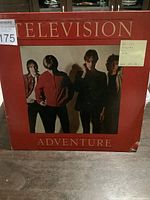 Front cover of the vinyl record album 'Adventure' by Television showing band photo and album title with some corner wear.