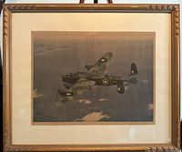 Framed airplane print showing the entire frame and artwork with visible carved wooden frame and matte.