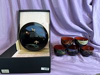 Plate set in box, showing lacquer plate and base with decorative cranes and flowers