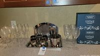 Full set of metal beverage serving tray with shaker, ice bucket, and small cups.