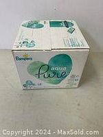 Box front and side views showing Pampers Aqua Pure branding and unopened condition