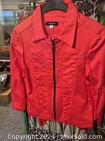 Red zip-up jacket with collar and front panel detailing, brand new with tags, size small/medium